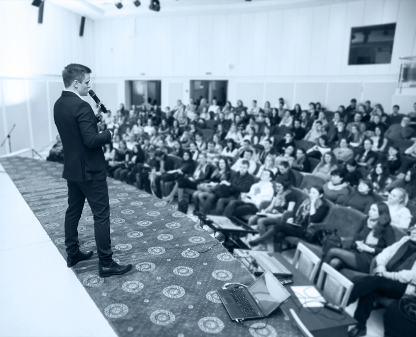 plan-and-pivot-live_events_02_ Corporate keynote speaker engaging a B2B audience at a branded event by Plan and Pivot Events