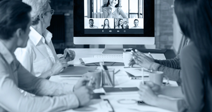 Hybrid event strategy meeting with remote and in-person teams at Plan and Pivot Events