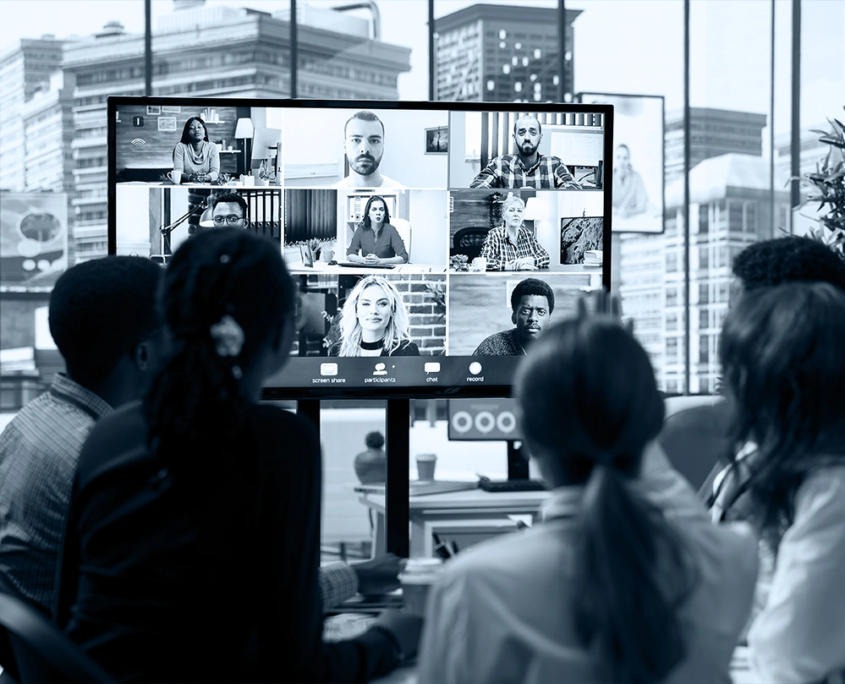 plan-and-pivot-virtual_events_03_ B2B event planning team in a hybrid strategy session with remote participants at Plan and Pivot Events